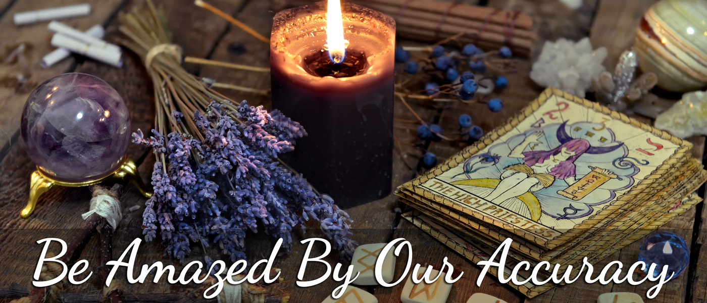 Be amazed by our accuracy. Items on table with a lit candle include tarot cards, lavendar, a crystal ball, geodes, and some marijuana joints.